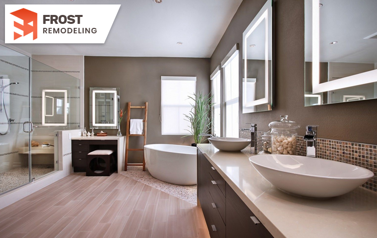 Stylish bathroom featuring a large walk-in shower with freestanding tub and LED mirrors