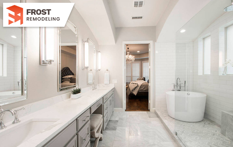 Modern small bathroom featuring a freestanding tub and vanity area