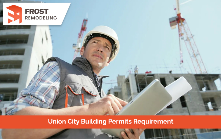 Professional reviewing building permit application with detailed construction plans