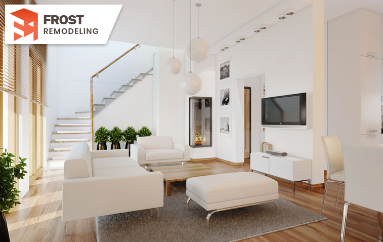 Open-concept living room with light colors and strategic accessory placement.