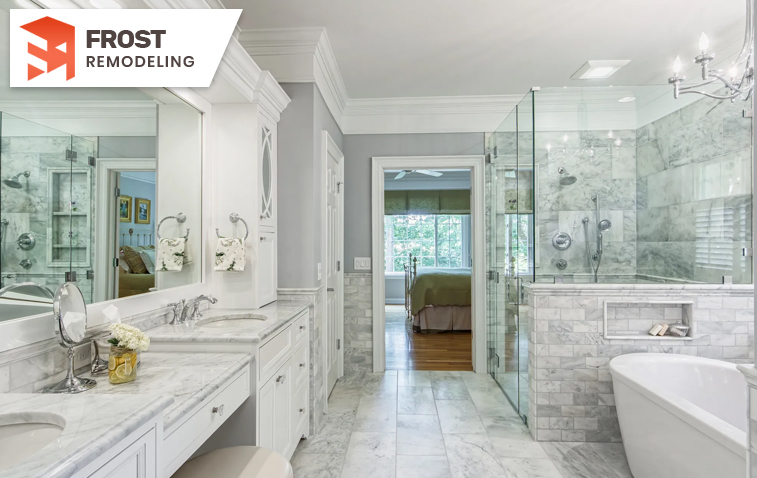 Spa-like bathroom featuring double vanity, and sleek tile work